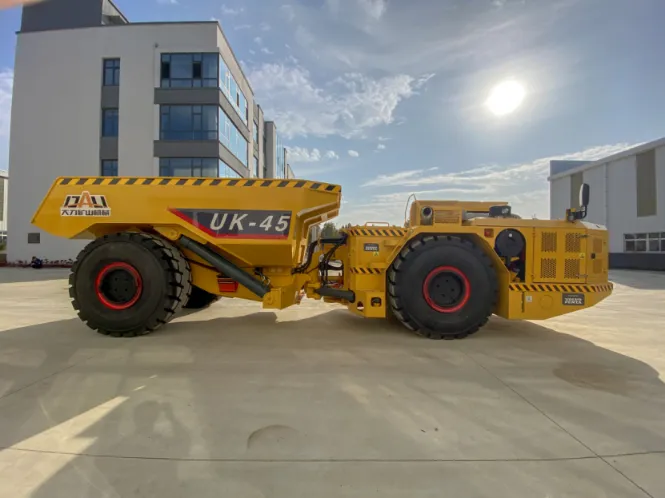 UK-45 underground mining dump truck operating inside a hard rock tunnel, showcasing low-profile design and heavy-duty haulage capability
