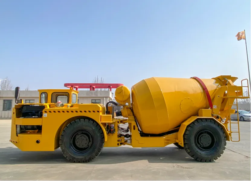 Side view of a yellow underground concrete mixer truck