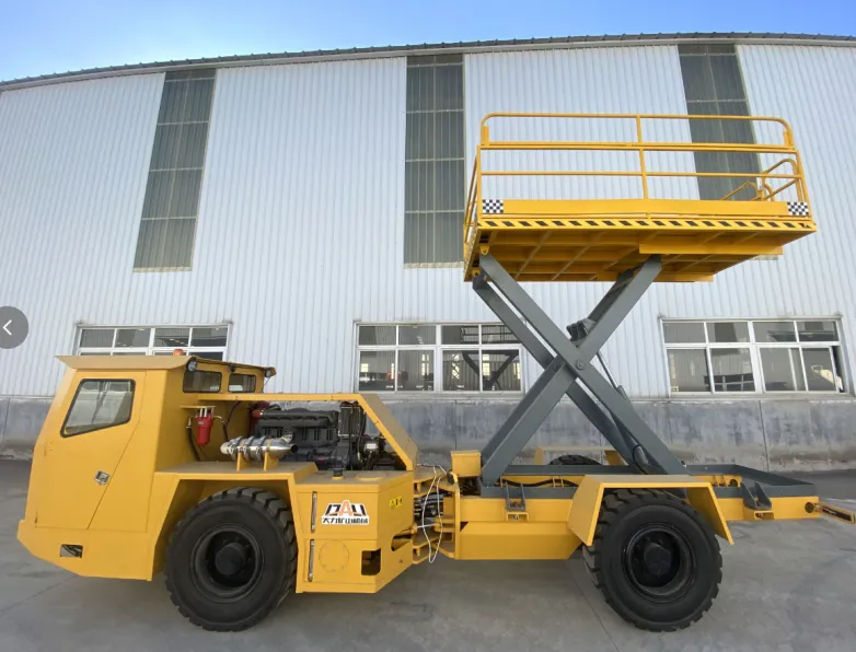 Yellow mining truck with a raised scissor lift platform