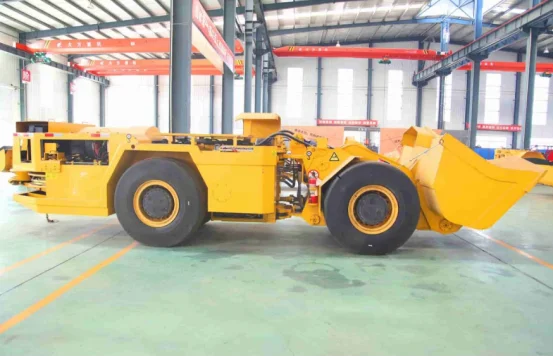 Yellow electric LHD loader in factory