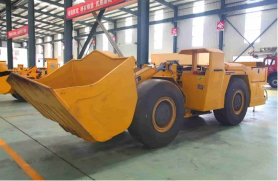 Yellow mining LHD loader with bucket