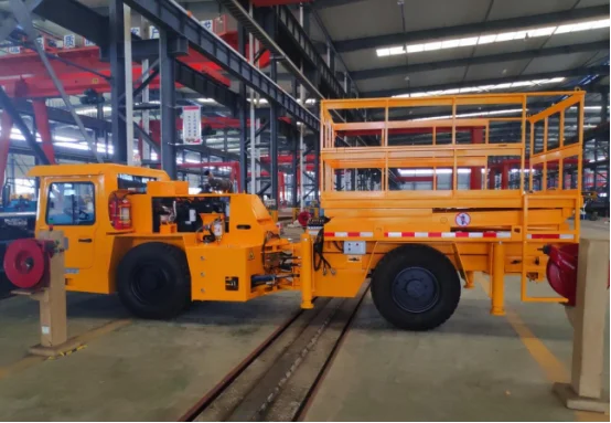 Yellow underground mining scissor lift in factory